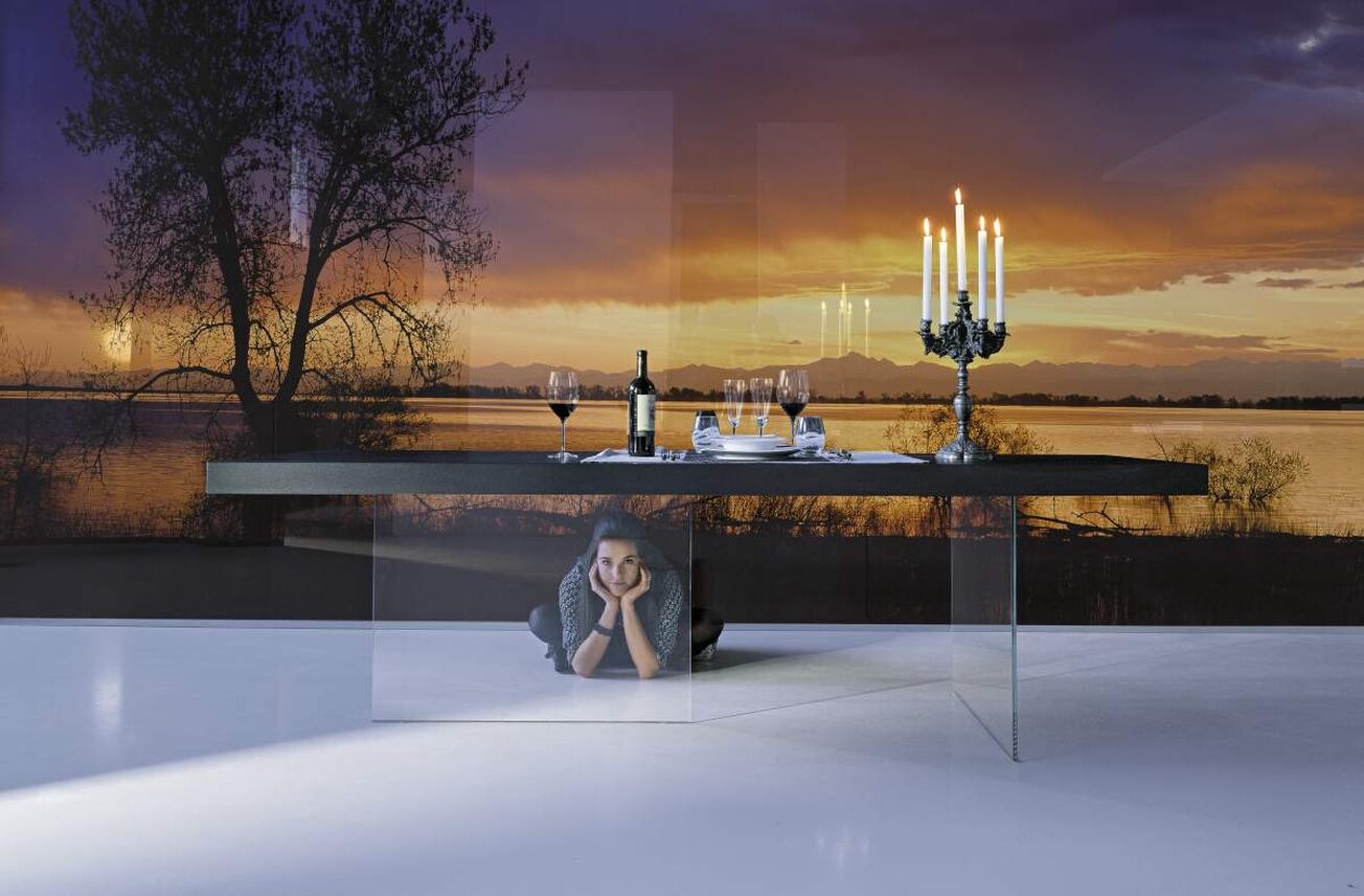Lago Air table in a dark timber finish with clear glass legs